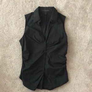 Express sleeveless top with collar.